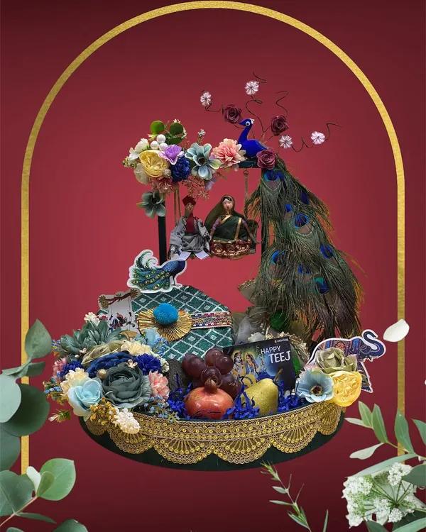 For Teej, we go all out with traditional elegance. This elaborate hamper features peacock feathers, intricate floral work, and classic motifs like elephants, all designed around the special gifts you want to include for your loved ones.