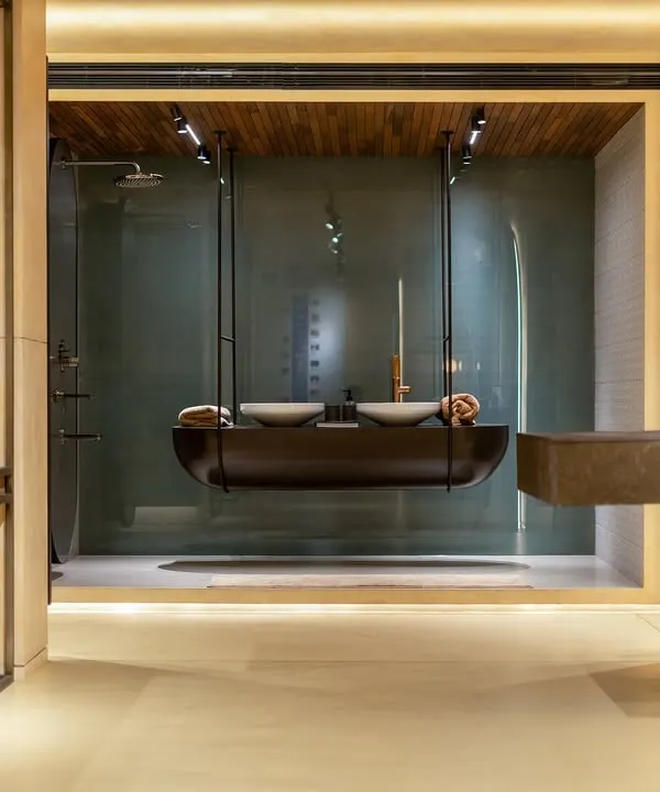 The suspended dual vanity at the Grohe showroom in Kochi is a prime example of my branded environment design. It's a functional display that also serves as a memorable art piece, defining the store's modern identity.
