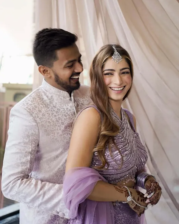 The laughter that starts a lifetime together. This candid shot from their engagement shoot perfectly captures the joyful, easy love between the couple.