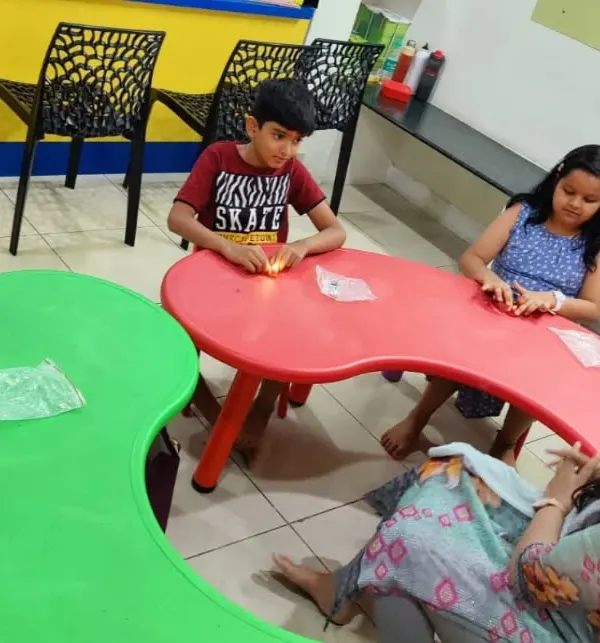A snapshot from our summer camp at Global Art. Students are seated and ready to dive into their hands-on science kits for the day.