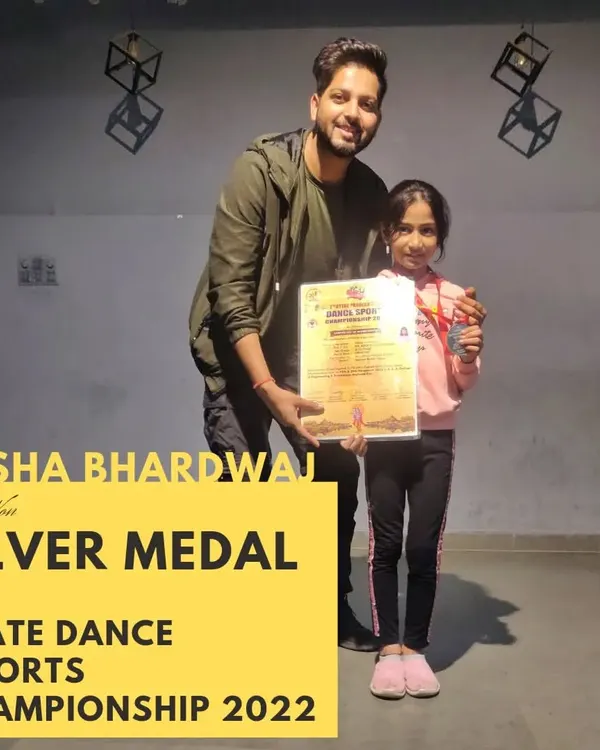 Here I am with my student Ipsha, celebrating her Silver Medal win at the 2022 State Dance Sports Championship. I provide specialized coaching for students who want to compete.