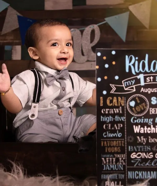 The first birthday is such a joyful milestone. We celebrate it with personalized sessions, like this one featuring a custom milestone board that highlights all of your baby's favorite things. It’s a fun and adorable way to remember their first big year.