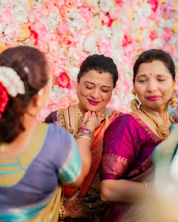 A candid, emotional moment between a mother and daughter at a wedding. It is a privilege to be a part of such special days and create makeup that holds up beautifully through happy tears.