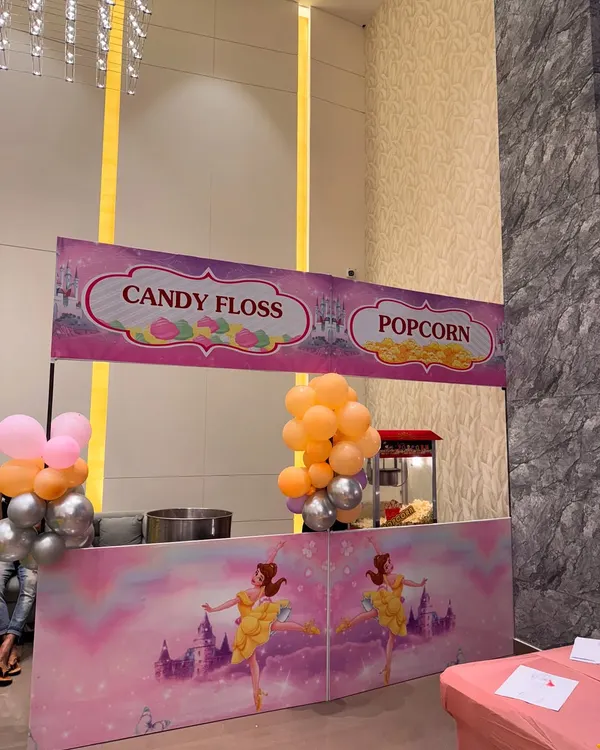 Sweet treats for a sweet occasion. We set up this adorable candy floss and popcorn station as part of a princess-themed baby welcome ceremony, adding a fun and tasty element for guests.