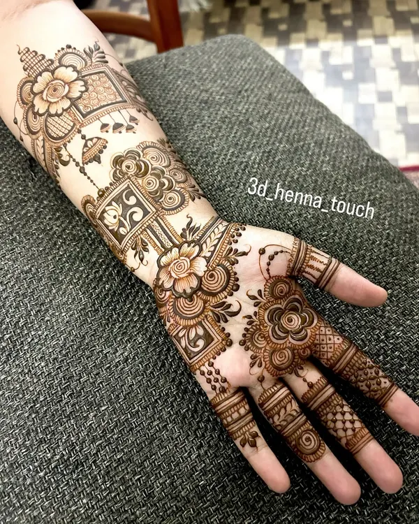 This Indo-Arabic design features a mix of bold flowers, hanging jhumkis, and geometric checks. The pattern flows diagonally, creating a modern and stylish look.