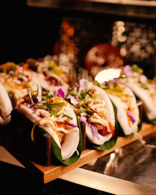 An artful display of our signature bao buns, filled with vibrant ingredients and drizzled with sauce. These fluffy, flavourful bites are a modern Pan-Asian favourite, perfect for networking events.