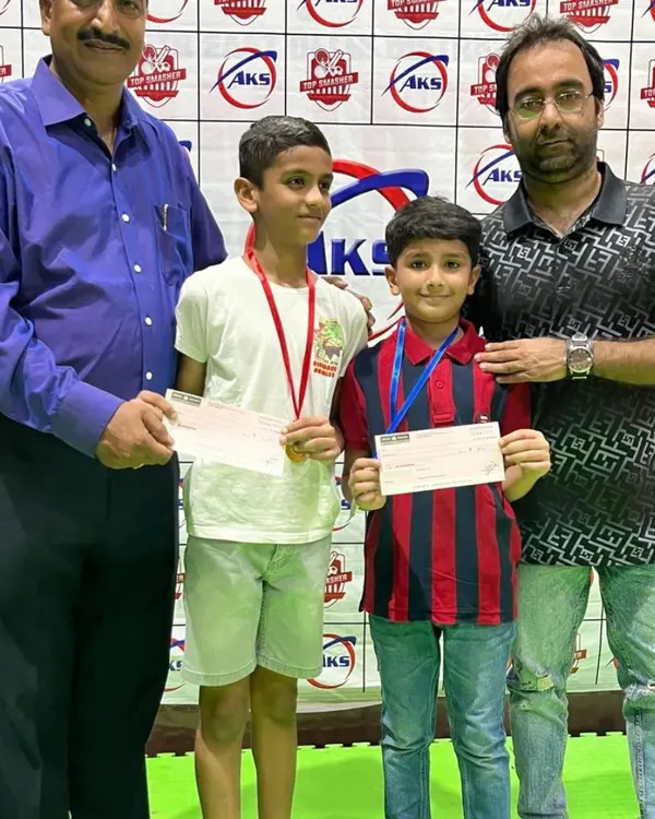 Here are two of our youngest champions proudly holding their prizes. My tournaments offer a supportive environment for players starting their competitive journey in badminton.