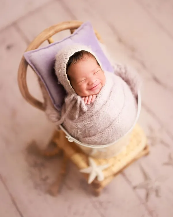 Let me brighten your weekend. This gorgeous smile is pure newborn joy. It's a reminder that even if babies don't sleep the whole session, we can capture incredibly heartwarming moments.