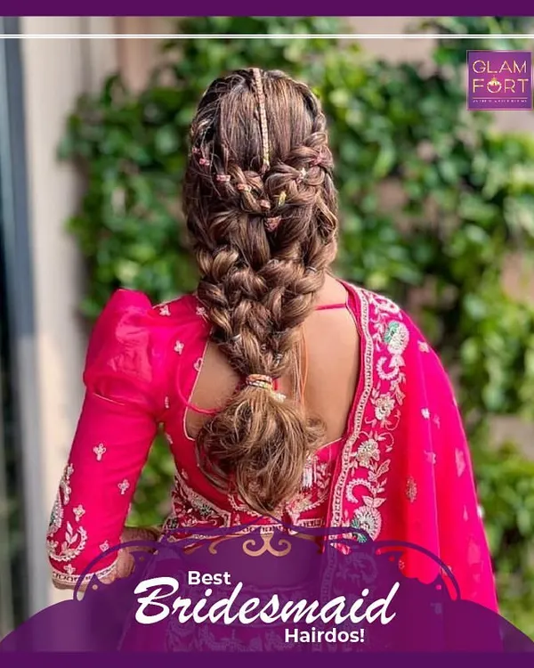 This intricate braided hairstyle is perfect for a bridesmaid or for a sangeet ceremony. It keeps the hair off the face while still looking incredibly detailed and beautiful.