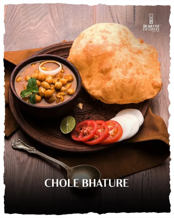 A classic North Indian favourite, Chole Bhature. The fluffy, deep-fried bhatura is the perfect companion to our spicy and flavourful chickpea curry.