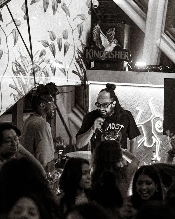 More than just a DJ, I’m an MC rooted in sound system culture. This shot captures me on the mic, hosting the night and keeping the crowd's energy high. I can run the show or just hype the vibe, whatever the event needs.