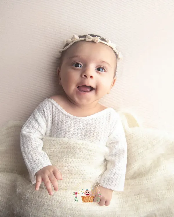 I just love the smiles of older babies. This little one is two months old, and her personality is already shining through. Don't worry if you miss the newborn window; we can capture beautiful, connected moments at any age.