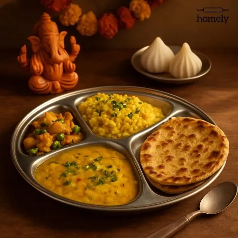 This is what a hug in a dabba looks like. My complete home-style thali includes a comforting dal, a simple sabzi, fluffy khichdi, and a soft paratha, all prepared with fresh ingredients and minimal oil. It’s the perfect balanced meal for your workday lunch or a quiet dinner.