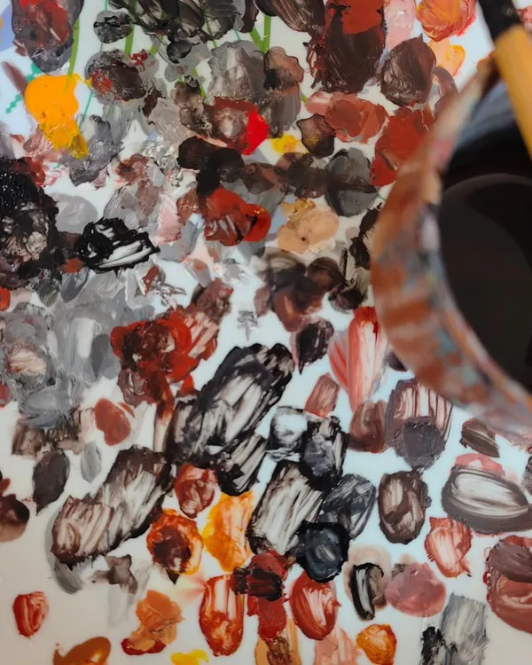 Paint-splattered tables and brushes that feel like an extension of our hands. For us, it's not about the outcome; it's about the process of becoming through each creation.