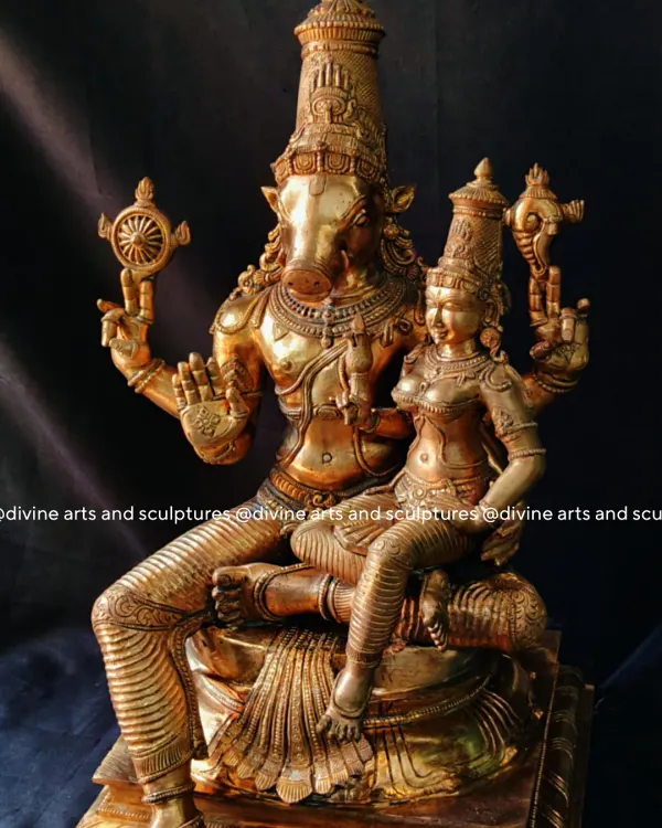 This sculpture of Lakshmi Varahar, Lord Vishnu in his Varaha avatar with Goddess Lakshmi, is a testament to our intricate detailing. The polished bronze finish brings out the divine radiance and blessings of strength and prosperity embodied in this form.