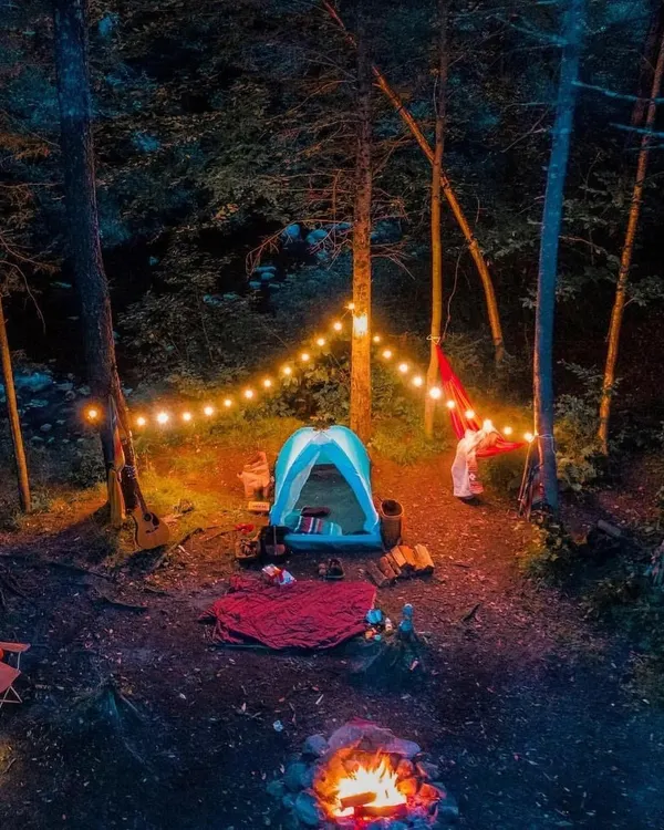 This is the essence of my curated experiences. A cozy tent, a hammock swaying between trees, the warm glow of fairy lights, and a crackling campfire. It’s more than just camping; it's creating a magical space for you to unwind and find peace in the forest.