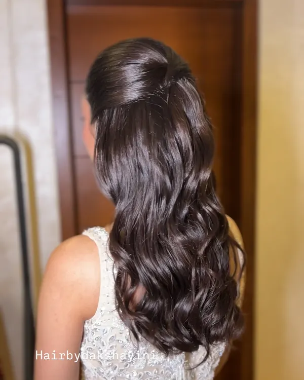 A beautiful half-up, half-down hairstyle with soft, voluminous waves. This look is created without crimping to give it a natural, healthy bounce.