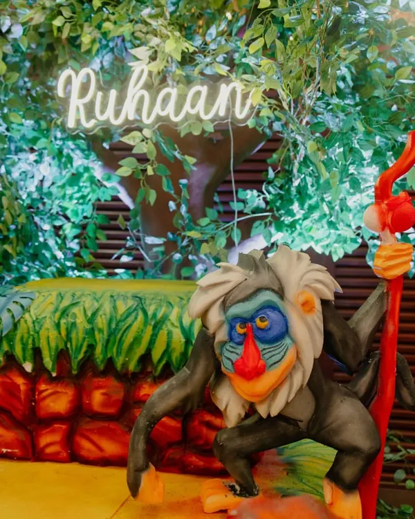 A detail from our Jungle Theme birthday decor. Featuring Rafiki from The Lion King and a custom neon name sign, we bring beloved characters to life.