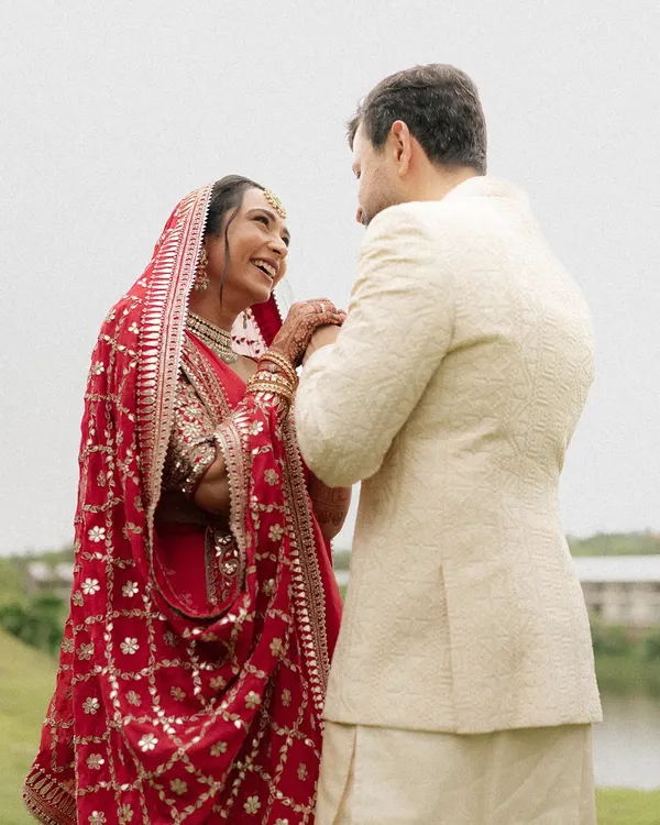 A candid moment of pure happiness between the bride and groom. Her joyful laugh and the way they look at each other is what we love to capture, the real connection that needs no posing.