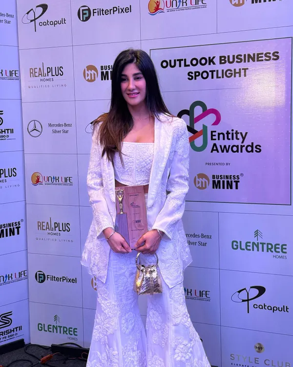 A proud moment accepting the 'Stylist of the Year' award from Outlook Business Spotlight. For the event, I wore a beautiful white embroidered co-ord set from Mishru.