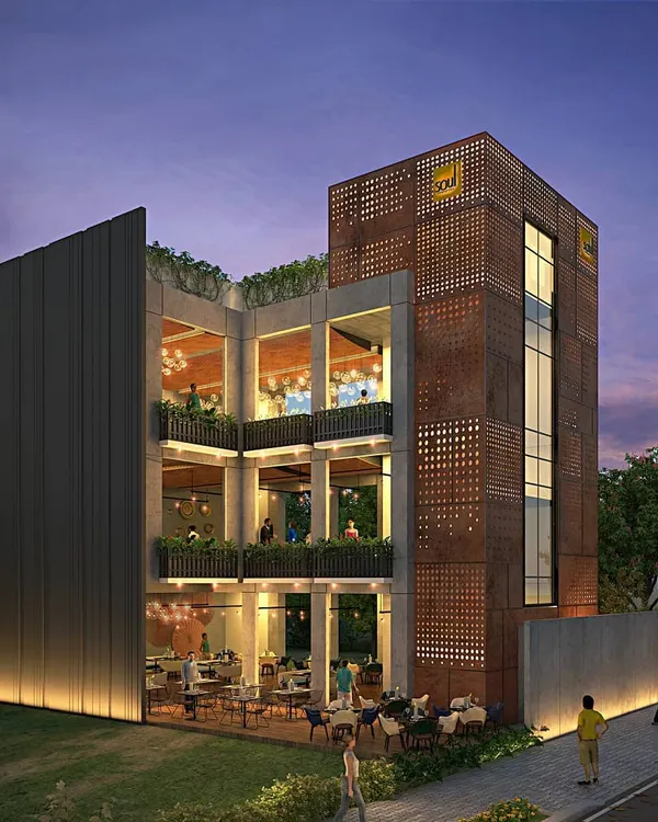 Our design for this commercial building in Koramangala features a distinctive facade using Corten steel and extensive glazing. The structure is designed for a food and beverage establishment, with multiple levels of indoor and outdoor seating to create a vibrant social hub.