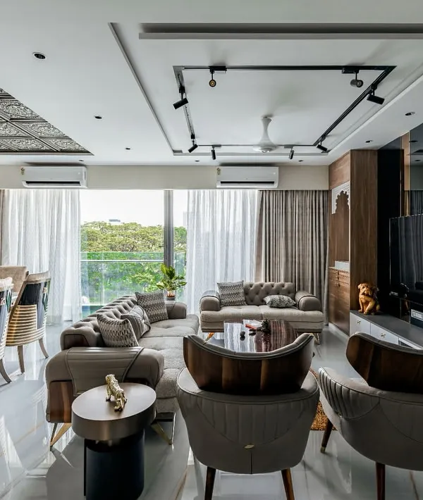 A look into this spacious and luxurious living and dining area we designed for a 4BHK apartment in Mumbai. We focused on creating a seamless flow between the two zones, using a sophisticated color palette, statement lighting, and elegant furniture to craft a space that is perfect for both relaxing and entertaining.