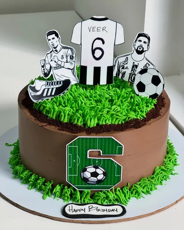 For the little champion who lives and breathes football. This cake features green turf piping, a custom jersey topper, and iconic players to turn a passion into a delicious moment.