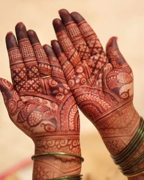 This is the beautiful, fresh stain on the second day after the henna paste was removed. The color is already developing into a rich reddish-brown, a sign of high-quality natural henna.