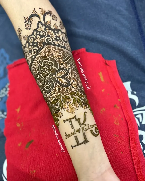 A special touch for bride Kulsum, with her and her partner Imad's initials 'I' and 'K' beautifully integrated into the forearm design.