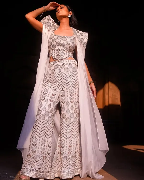 A powerful moment captured in the sunlight. I love playing with natural light and shadows to create dramatic, high-impact fashion portraits that feel both timeless and modern. This shot highlights the intricate details of the garment and the model's commanding presence.