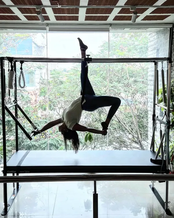 This is your way to find the best version of yourself. This beautiful pose on the Cadillac requires incredible core strength, flexibility, and trust in your body.