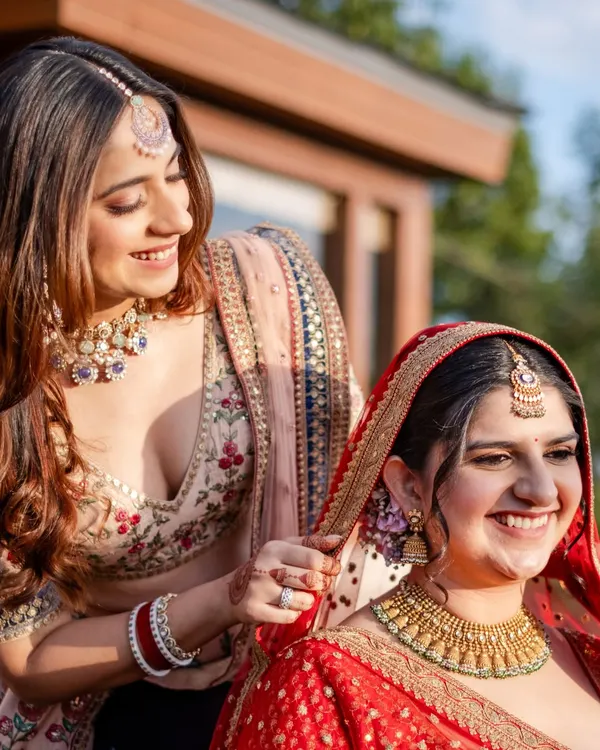 Some bonds don’t just witness your story, they become the story itself. A sister adjusting the bride's veil is a perfect example of the quiet, beautiful moments that make a wedding timeless.