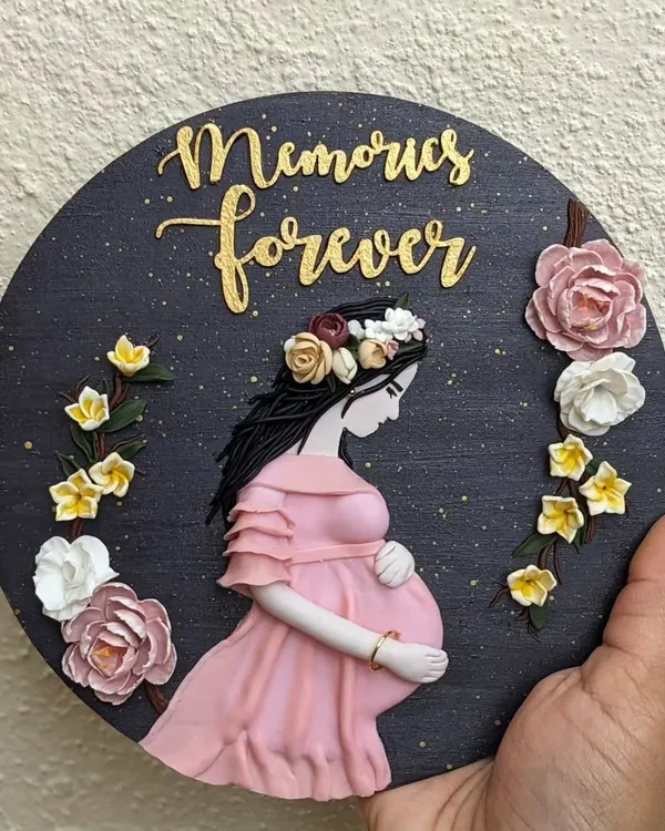 A perfect way to imprint memories forever. This custom wall art was created for an expecting mother, celebrating a beautiful milestone with delicate, hand-sculpted flowers.