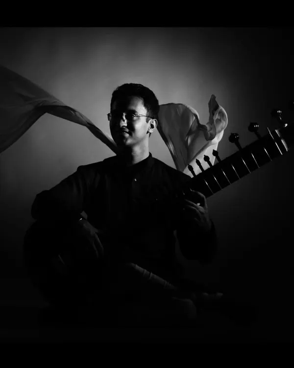 A dramatic black and white studio portrait. This artistic style is great for album covers and cultural event promotions.