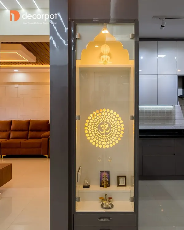 This sleek, modern pooja unit is designed to fit perfectly between a pillar and a wall. The backlit Om mandala creates a divine glow, and the glass doors keep the space serene and dust-free.