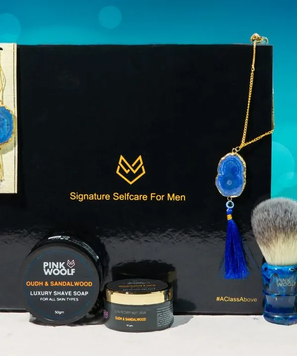A festive Raksha Bandhan themed product shot for Pink Woolf's men's self-care kit. The image combines the products with traditional elements to create a perfect gift-giving visual.