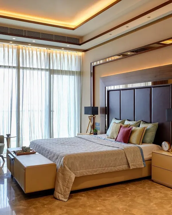 For our 'Omkar' project, this bedroom was designed with immaculate detailing to promote clarity of mind. We used clean lines and intentionally soothing, layered lighting to create a serene sanctuary that is both minimalistic and lucid, providing a perfect start and end to each day.