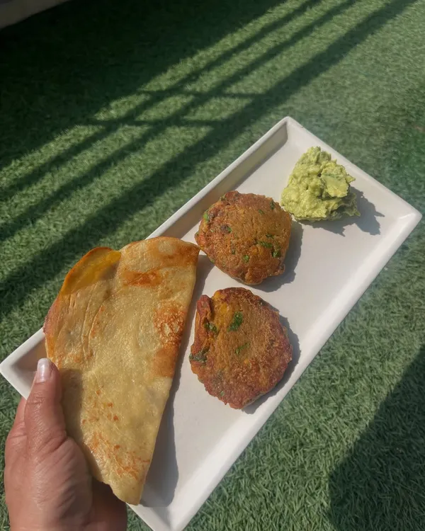 A protein-rich breakfast perfect for Sawan, featuring mushroom kababs, quinoa moong dal chilla, and a creamy avocado dip.