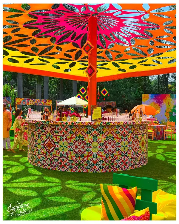 This circular bar was the centerpiece for a vibrant Holi festival. The intricate patterns, custom canopy, and explosive colors show how I can build a high-energy, branded experience for large-scale outdoor events.