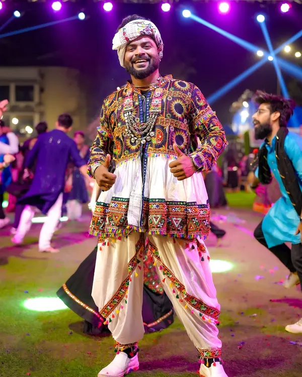 Hosting large-scale public festivals like Navratri is my passion. Here I am at Raasleela Mumbai, dressed in traditional attire, connecting with thousands of people through music, dance, and pure festive energy.