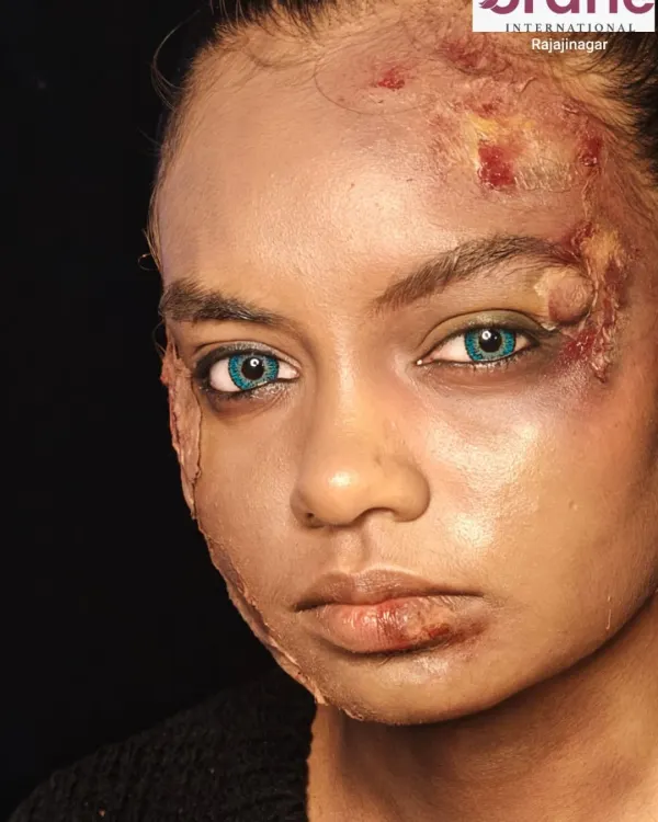 A chillingly realistic SFX makeup look featuring simulated burn wounds and bruises. This level of detail is taught in our advanced SFX course for aspiring media makeup artists.