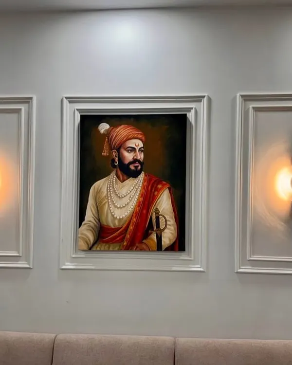 This custom portrait of Chhatrapati Shivaji Maharaj is one of my most requested works. I focused on capturing his powerful and dignified presence, creating a statement piece that brings a sense of history and pride to the home. It is shown here beautifully installed in a client's living room.