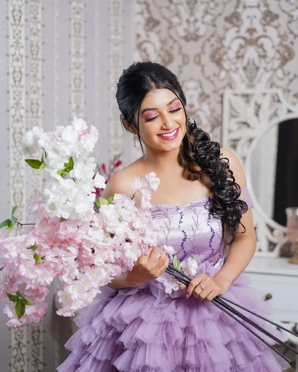 Our lavender ruffle gown paired with a bouquet of cherry blossoms against our vintage damask wallpaper and vanity set. This setup is perfect for romantic, whimsical photos.