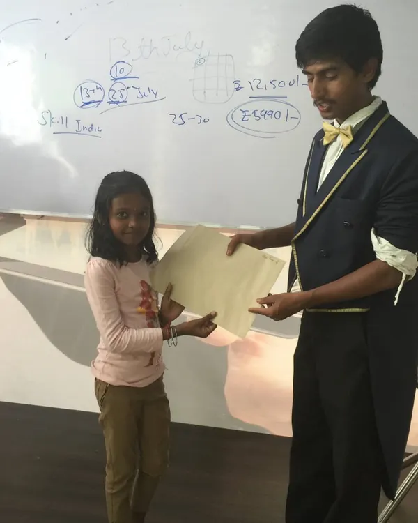 One of my favorite moments. This young magician has just completed the beginner magic class and is receiving her magician-in-training certificate. It's a proud moment for both of us.