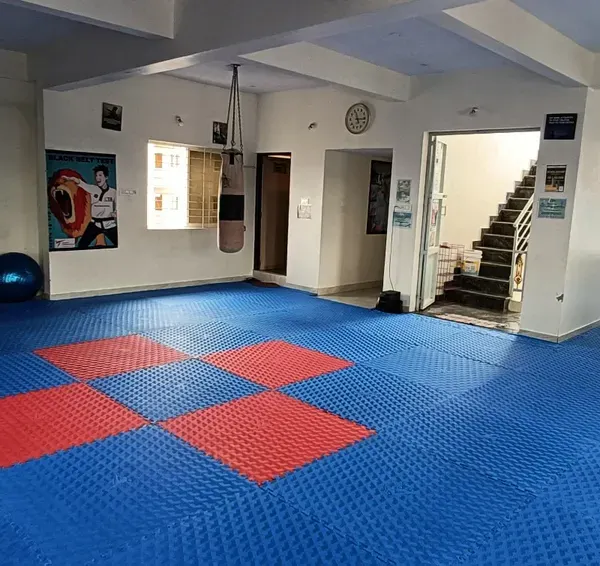 A view of our spacious and clean dojang, with matted floors ready for training.