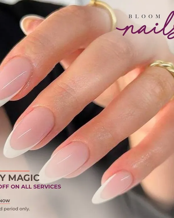 A perfect example of a classic French manicure on long, elegant almond-shaped extensions. The clean white tips and sheer pink base create a timeless and sophisticated look.
