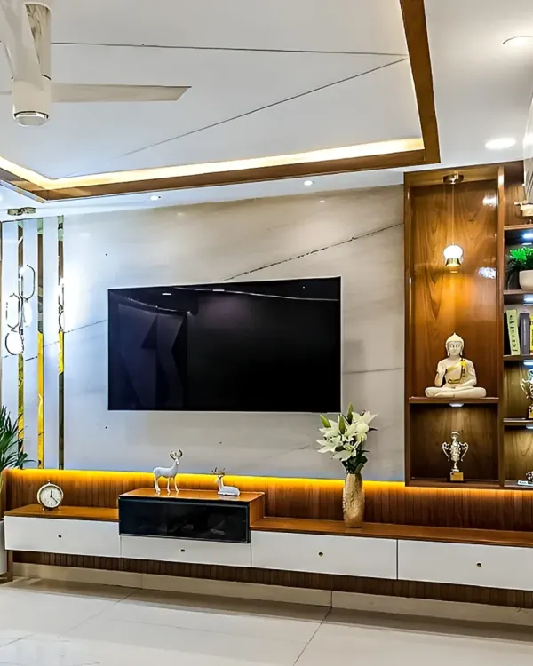 We design living rooms that are both stunning and practical. This entertainment hub features a full-wall TV unit with integrated ambient lighting, rich wood finishes, and ample storage, creating a luxurious focal point for the entire family.