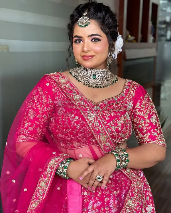 A perfect example of a modern reception look. My students learn to create this flawless, camera-ready makeup with a beautiful pink lehenga and diamond jewelry.