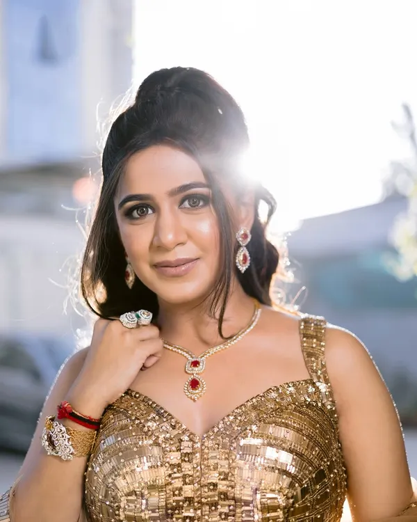 Backlit and beautiful, this bride is ready for her Sangeet. I created a golden goddess look with shimmering makeup and a voluminous hairstyle to match her spectacular sequined lehenga.