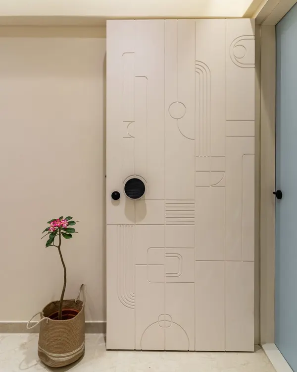 A close-up of our modern, minimalist door design. The grooved geometric pattern adds texture and a unique artistic touch, making the entrance a statement piece.